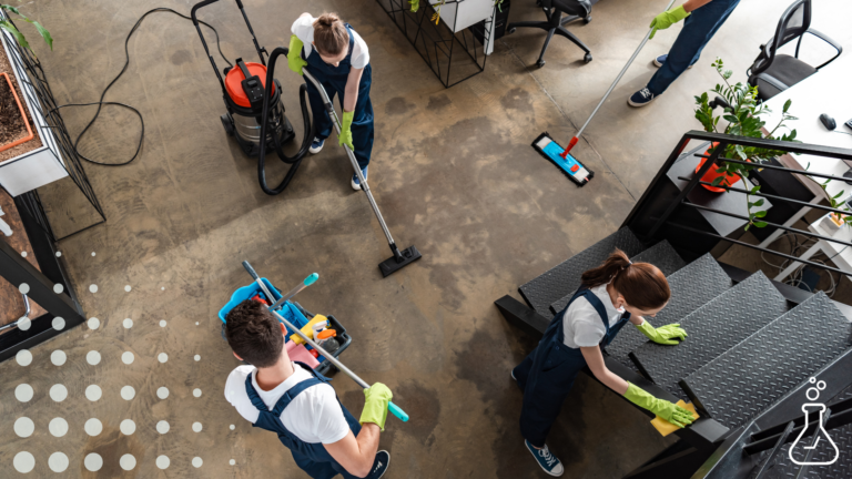 A group of people perform cleanup tasks at an office